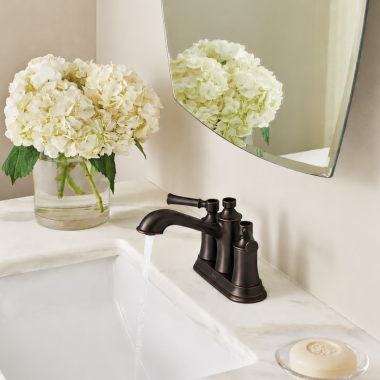 Click here to see  6802ORB Moen Dartmoor Two-Handle Centerset Bathroom Faucet with Metal Pop-Up Drain, 1.2 GPM, Oil Rubbed Bronze - 6802ORB