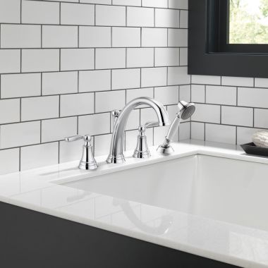 Click here to see Delta T4732 Delta Woodhurst Two-Handle Roman Tub Faucet Trim w/ 1.75 GPM Single-Setting Hand Shower, Lever Handles, Chrome - T4732
