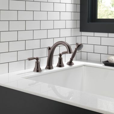 Click here to see Delta T4732-RB Delta Woodhurst Two-Handle Roman Tub Faucet Trim w/ 1.75 GPM Single-Setting Hand Shower, Lever Handles, Venetian Bronze - T4732-RB