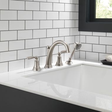 Click here to see Delta T4732-SS Delta Woodhurst Two-Handle Roman Tub Faucet Trim w/ 1.75 GPM Single-Setting Hand Shower, Lever Handles, Stainless - T4732-SS