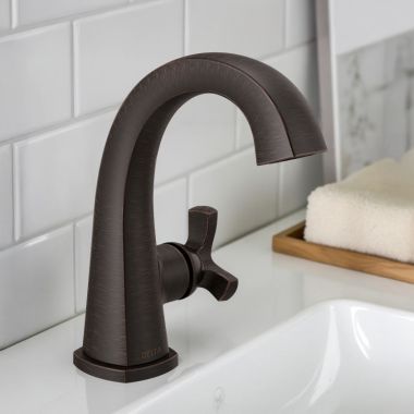 Click here to see Delta 5776-RBMPU-DST Delta Stryke Single Handle Deck Mounted Bathroom Faucet With Drain, Helo Spoke, 1.2 GPM, Venetian Bronze - 5776-RBMPU-DST