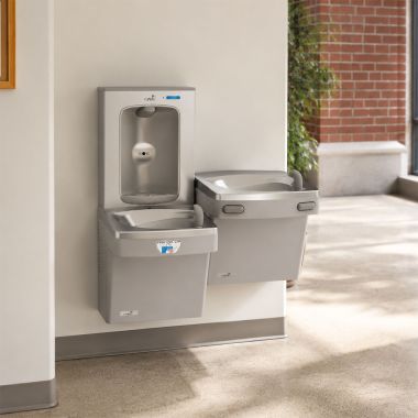 Click here to see Oasis 507086 Oasis VersaCooler II Bi-Level Contactless and Mechanical Drinking Fountain w/ Electronic Bottle Filler, Non-Refrigerated, Greystone - PGEBFSLTM (507086)