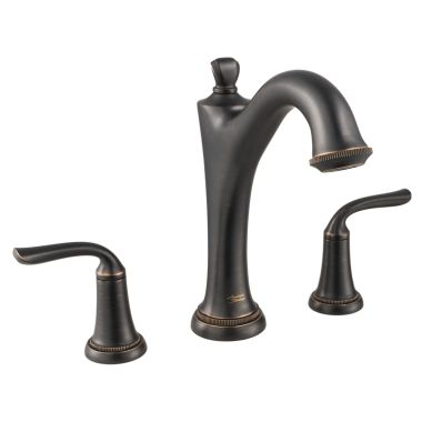 Click here to see American Standard T106900.278 American Standard Patience Two-Handle Legacy Bronze Deck Mounted Roman Tub with Built-in Diverter, ADA, Metal Lever Handles - T106900.278